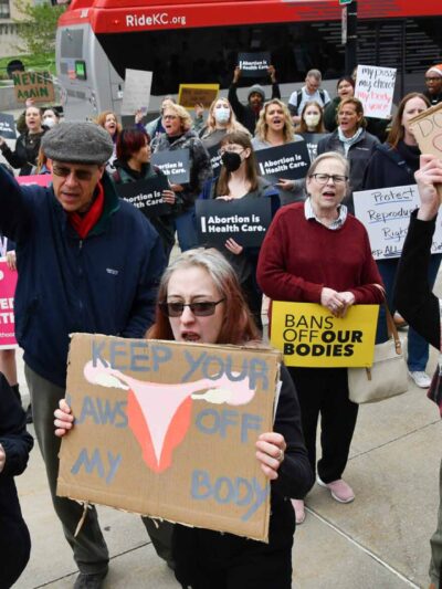 Carlos Moreno / KCUR 89.3 Members of the crowd chant during a rally at the Jackson County Courthouse in Kansas City on Tuesday where protesters gathered to decry the leaked draft opinion by the U.S. Supreme Court indicating the landmark Roe v. Wade case