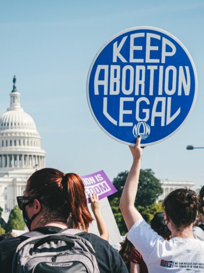 Rally at capitol featuring sign that reads, "Keep abortion legal"