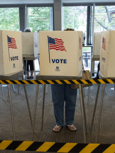 A voter fills out an advance ballot on July 29, 2022, at the Shawnee County Elections Office. (Sherman Smith/Kansas Reflector)