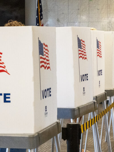 Voting booths stand side by side on July 29, 2022, at the Shawnee County Elections Office. (Sherman Smith/Kansas Reflector)