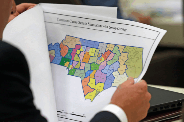 Person holding and reading district map