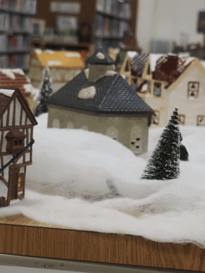 A Christmas village display is set up inside the Pottawatomie Wabaunsee Regional Library. (Rachel Mipro/Kansas Reflector)