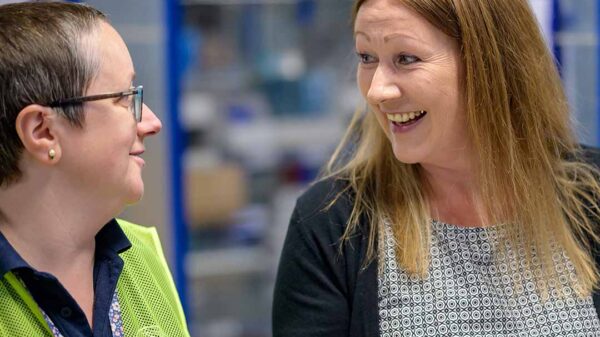 Person using clipboard to help another person
