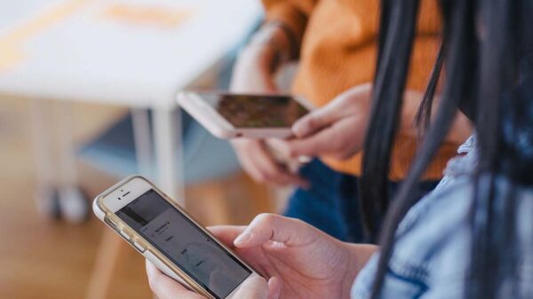 two people on their phones