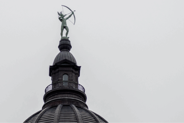The Ad Astra statue atop the Statehouse aims for a brighter tomorrow on a gloomy Jan. 24, 2023. (Sherman Smith/Kansas Reflector)
