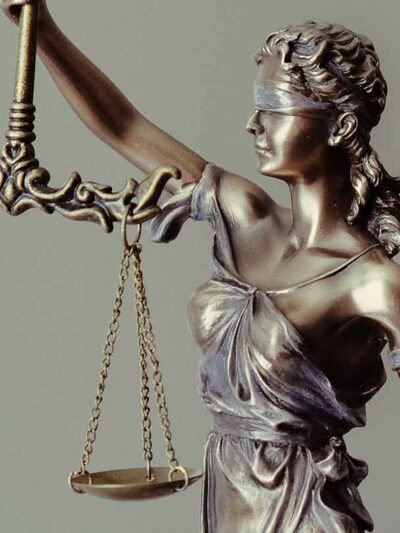 Blindfolded Lady Justice holding scales