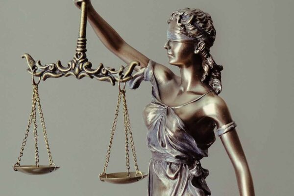 Blindfolded Lady Justice holding scales