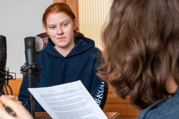 Chloe Chaffin, facing the camera, appears with Kansas Reflector reporter Rachel Mipro for a podcast recording on March 23, 2023, at the Kansas Reflector office in downtown Topeka. (Sherman Smith/Kansas Reflector)