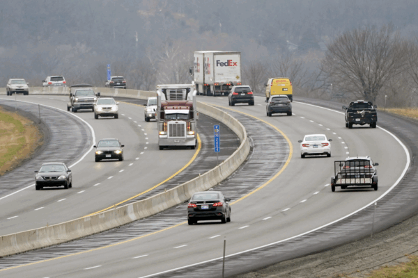 Orlin Wagner/AP Photo Vehicles travel along I-70 near Lawrence, Kan., Wednesday, Nov. 25, 2020.