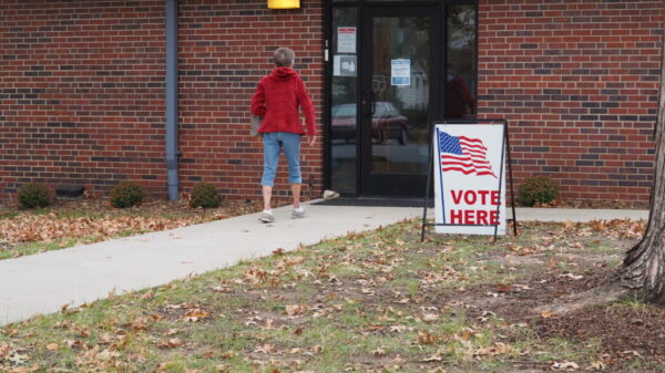 voter at a poll kansas reflector