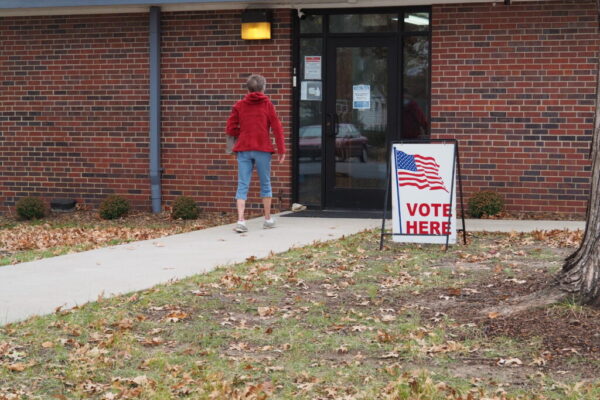 voter at a poll kansas reflector