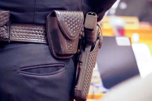 gun on hip of officer