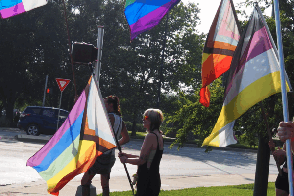 Ahead of SB 180’s implementation, Lawrence campaigners lobby for the city to be made into a sanctuary city for transgender Kansans on June 20, 2023. (Rachel Mipro/Kansas Reflector)