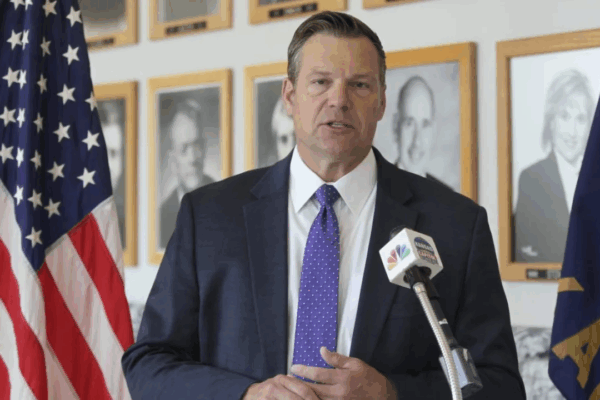 Kansas Attorney General Kris Kobach answers questions from reporters during a news conference outside his office, Monday, May 1, 2023, in Topeka, Kan. (AP Photo/John Hanna, File)