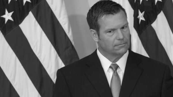 Black and white photo of Kris Kobach