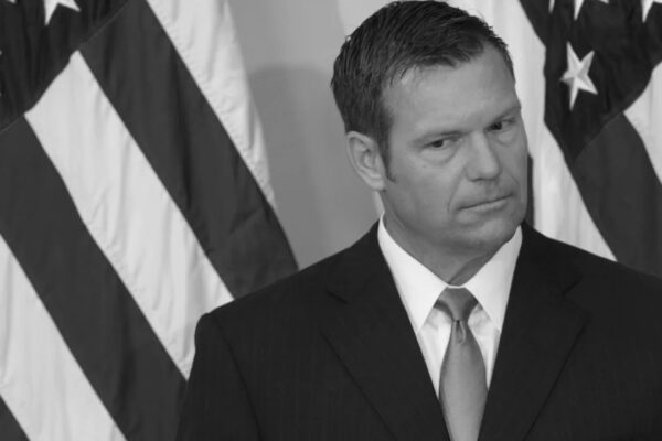 Black and white photo of Kris Kobach