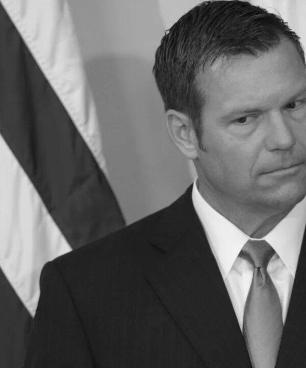 Black and white photo of Kris Kobach