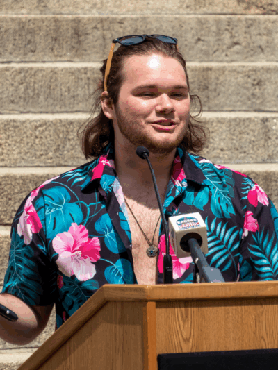 Adam Kellogg speaks during rally in support of transgender rights May 5, 2023, at the Statehouse in Topeka. Kellogg is one of the five transgender Kansan's represented by the ACLU in a case involving gender markers on driver's licenses. (Sherman Smith/Kan
