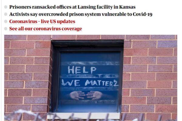 Signs pleading for help are seen in the windows at the Cook county jail complex in Chicago, Illinois, on 9 April. THE GUARDIAN