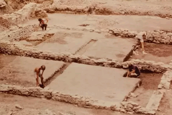 Workers handle preservation duties duringa 1980s excavation of the Quindaro site. They are working on the old J.B. Upson Building, which housed a clothing store and served as offices for the Chindowan newspaper. ( Larry Schmits)