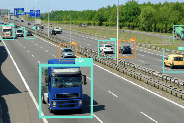 Cars driving on highway with AI boxes identifying them