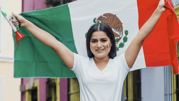 Woman holding a Mexican flag