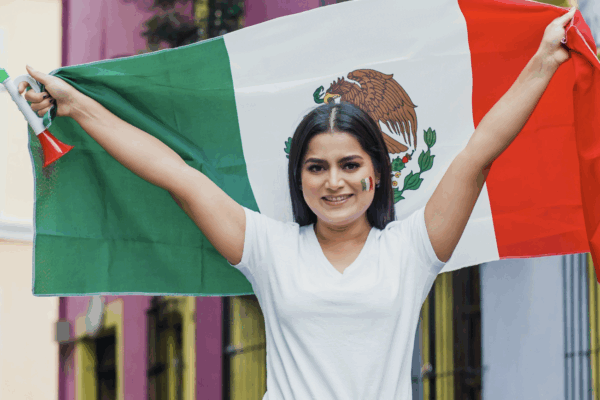 Woman holding a Mexican flag