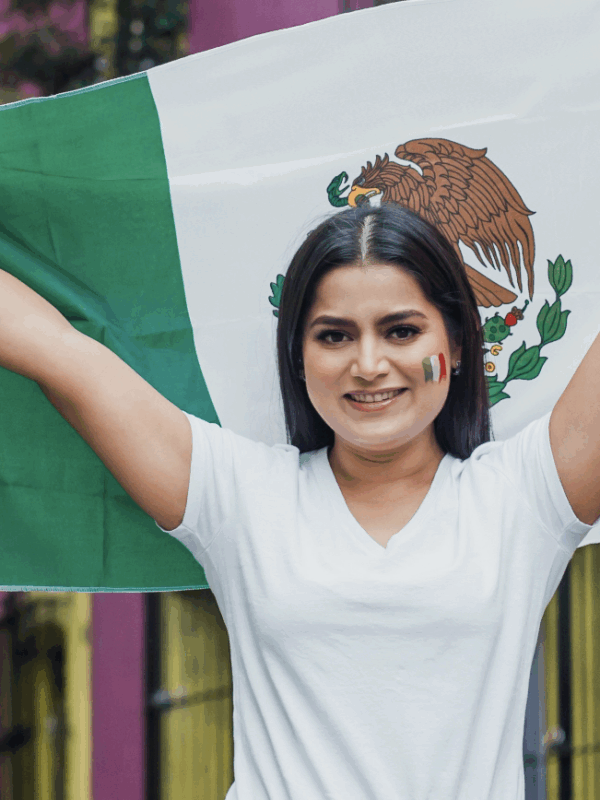 Woman holding a Mexican flag