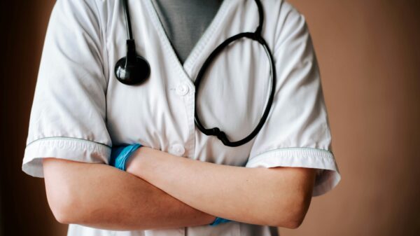 medical professional with arms crossed