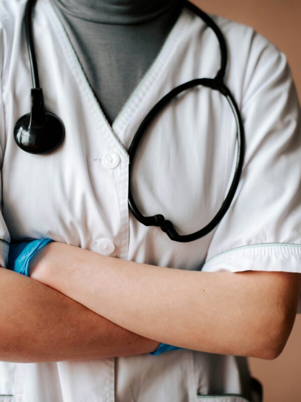 medical professional with arms crossed