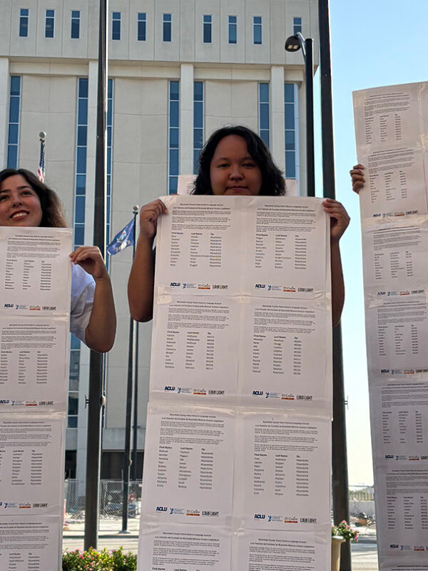 Activists holding long lists of names