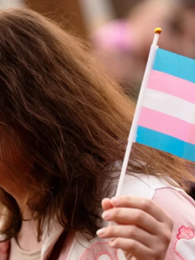 Person holding trans flag