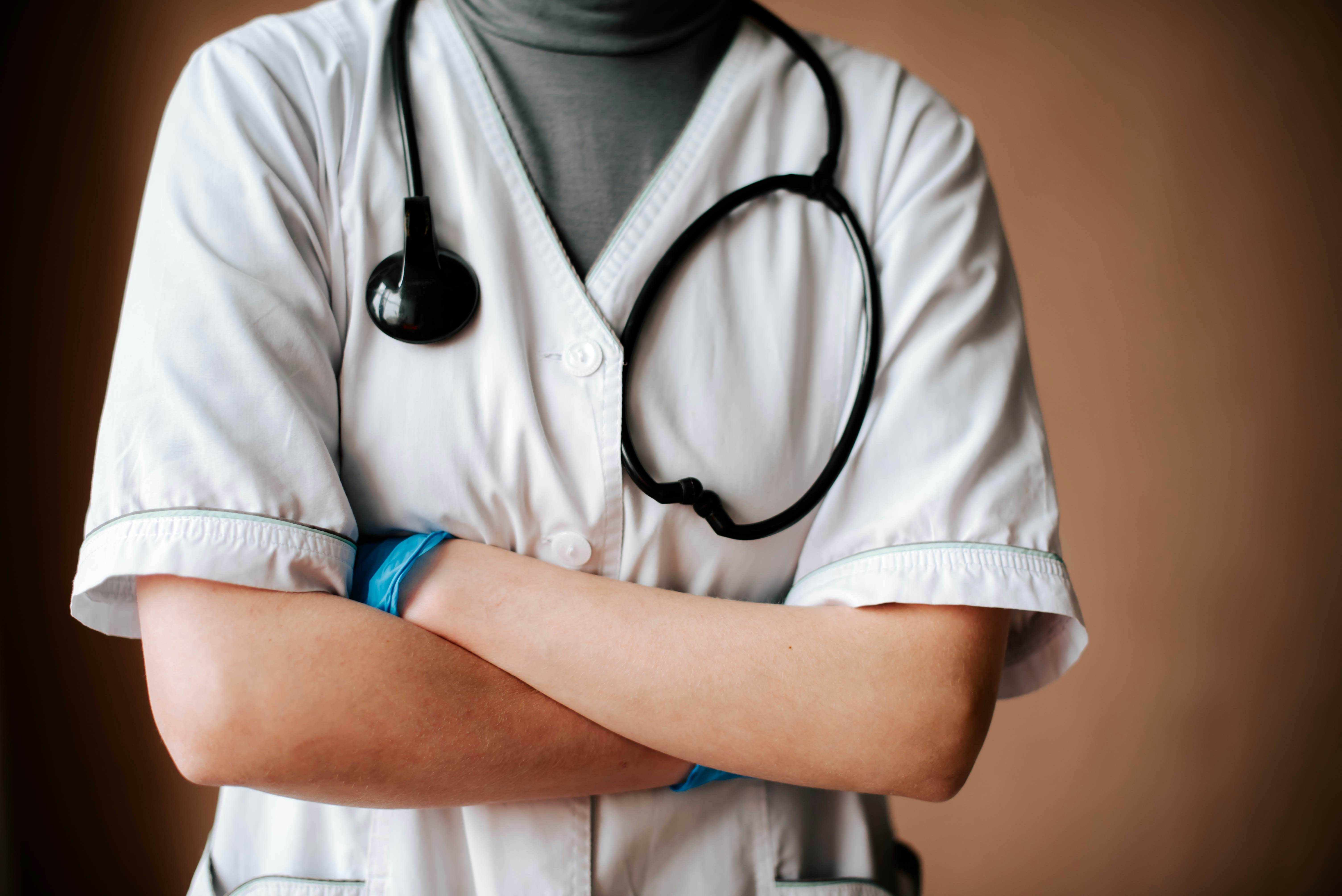 medical professional with arms crossed