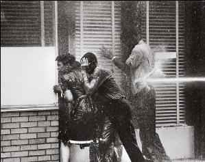 Birmingham civil rights activists being sprayed by water cannons
