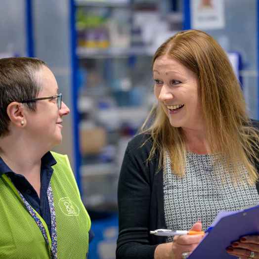 Person using clipboard to help another person