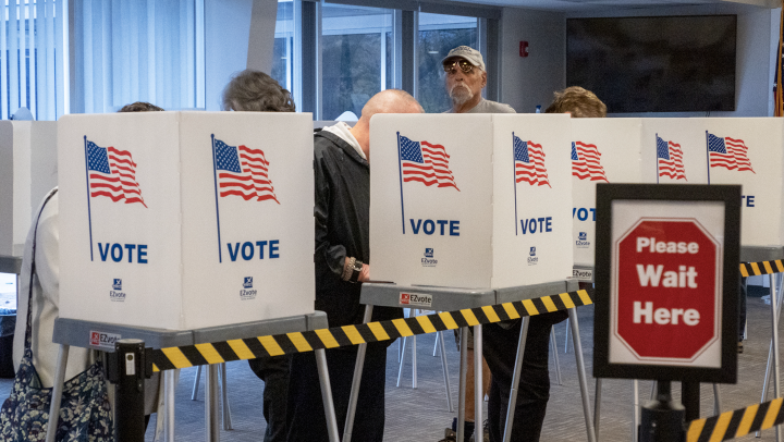 Voters fill out advanced ballots Oct. 25, 2022, at the Shawnee County Election Office in Topeka. (Sherman Smith/Kansas Reflector)