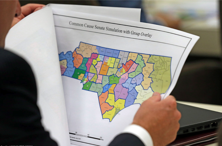 Person holding and reading district map