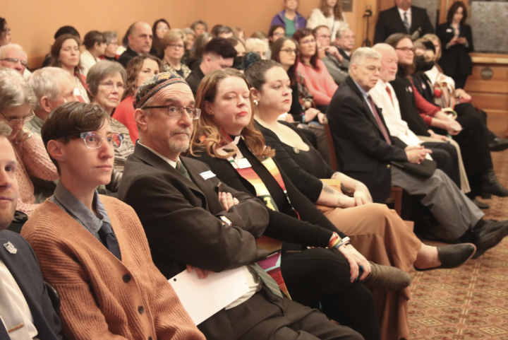 Few empty seats remained as supporters and opponents of the bill packed into the committee room.