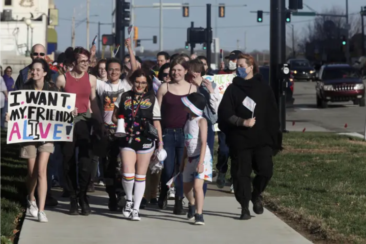 Protesters march outside the Kansas Statehouse on Transgender Day of Visibility, March 31, in Topeka, Kansas. John Hanna /AP