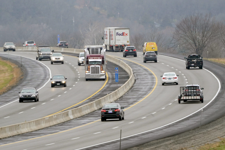 Orlin Wagner/AP Photo Vehicles travel along I-70 near Lawrence, Kan., Wednesday, Nov. 25, 2020.