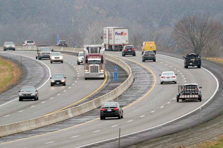 Vehicles travel in advance of Thanksgiving along I-70 near Lawrence, Kan., Wednesday, Nov. 25, 2020. Orlin Wagner/AP Photo
