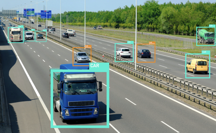 Cars driving on highway with AI boxes identifying them
