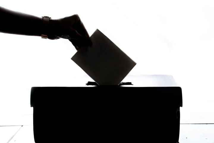 Ballot being dropped into ballot box