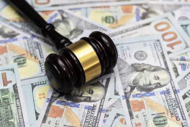 gavel on top of money