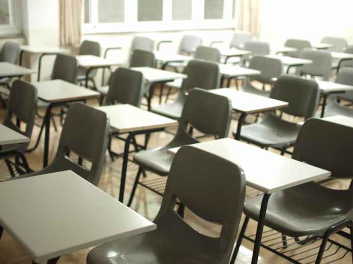 Empty desks in school classroom