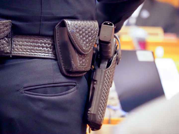 gun on hip of officer