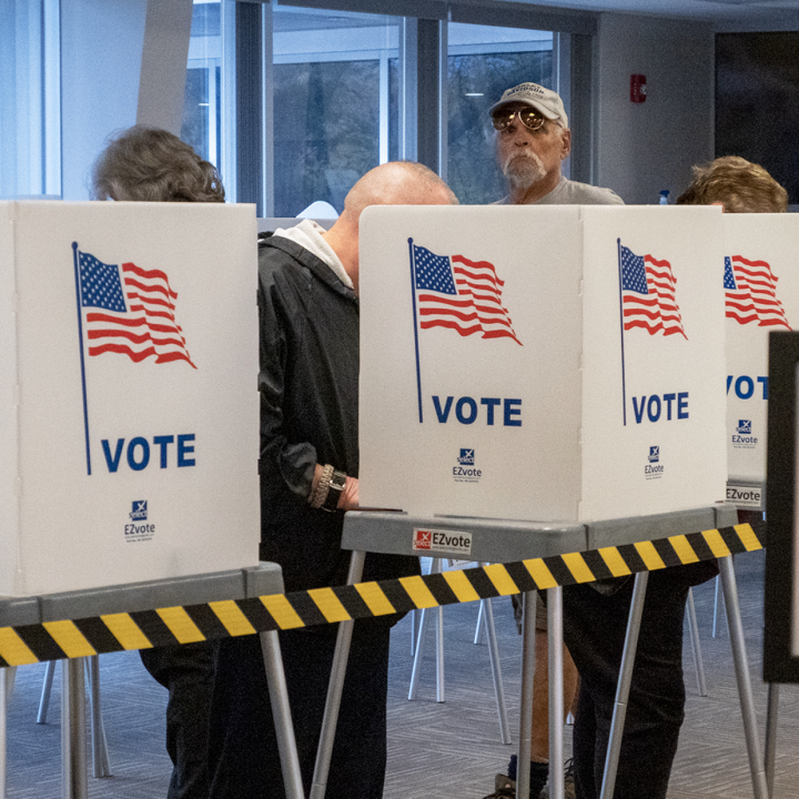Voters fill out advanced ballots Oct. 25, 2022, at the Shawnee County Election Office in Topeka. (Sherman Smith/Kansas Reflector)