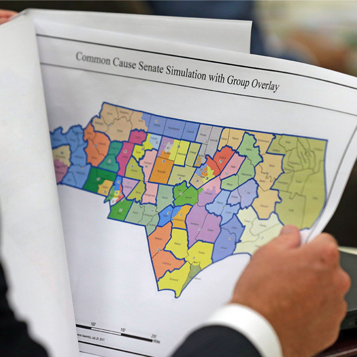 Person holding and reading district map