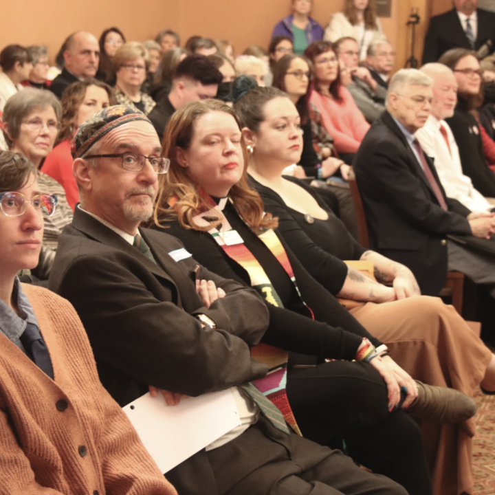 Few empty seats remained as supporters and opponents of the bill packed into the committee room.