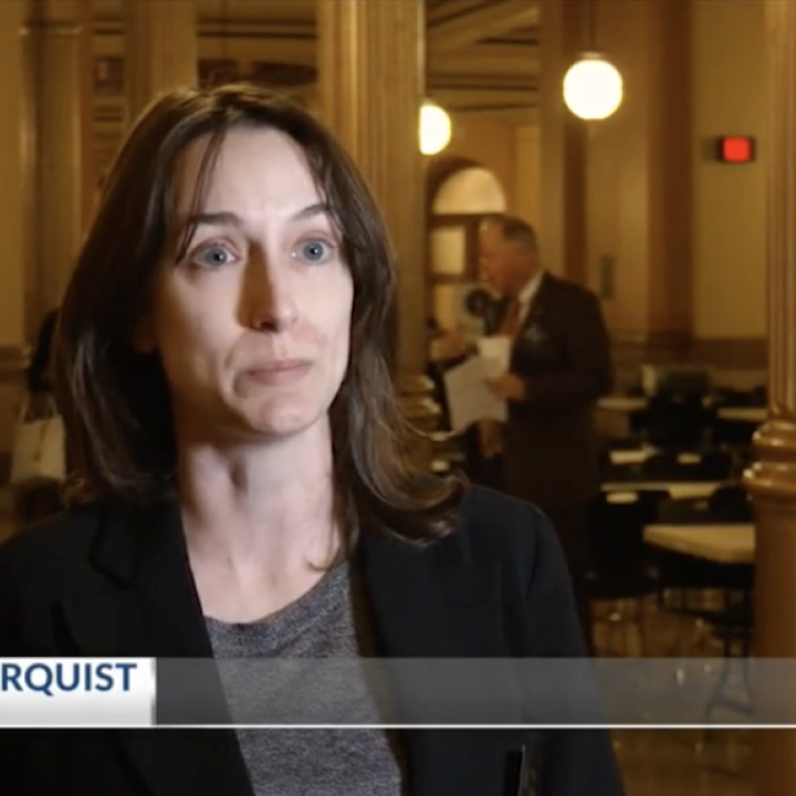 Screen of Aileen Berquist, Director of Policy from news segment
